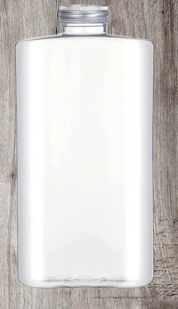 a clear flask sitting on top of a wooden table